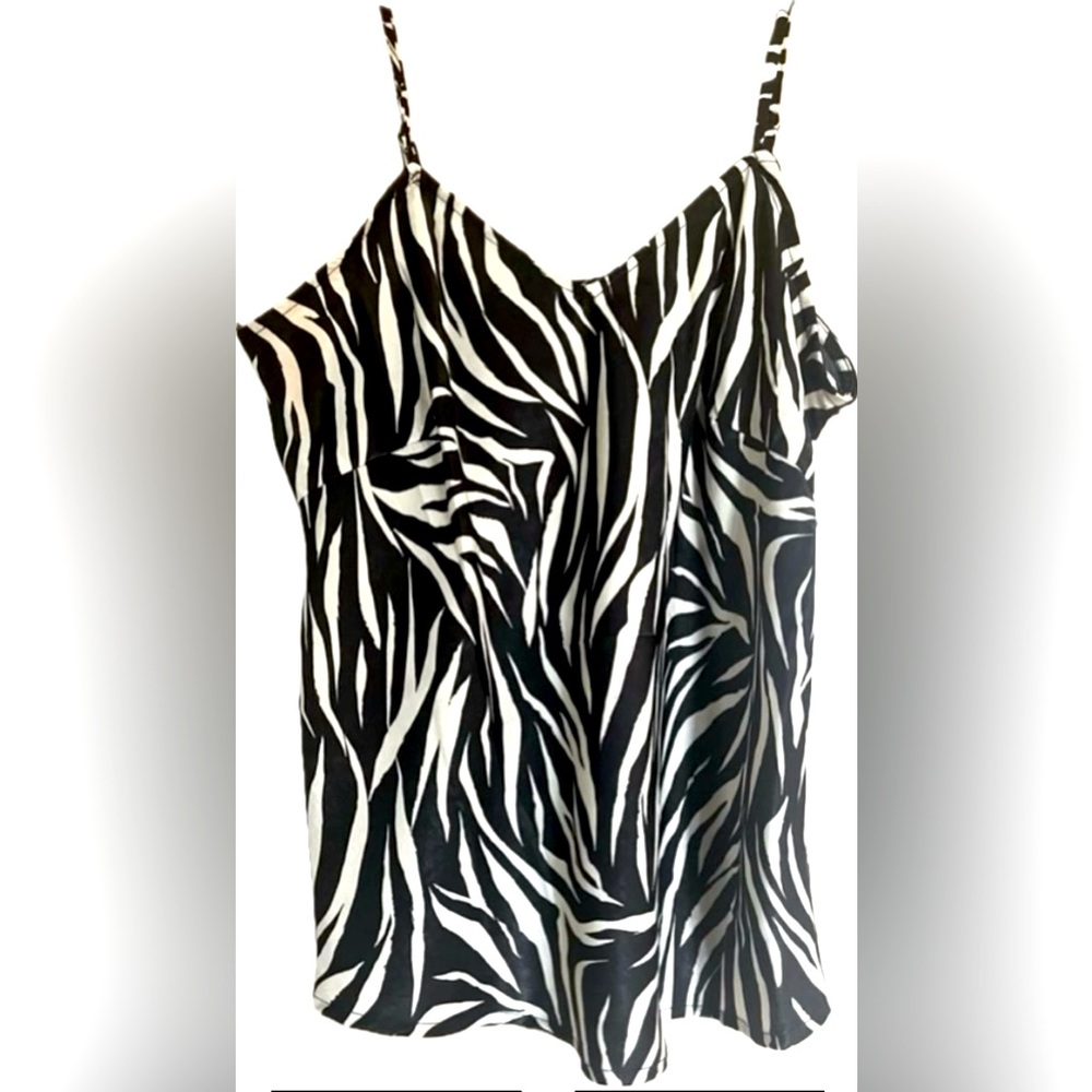 Zebra print camisole. Features adjustable straps. New with tags. Size Small